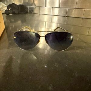 Louis Vuitton black and gold aviator. Wore 2x bought at Vegas LV store